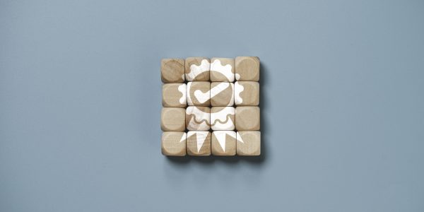 Quality assurance icon which print screen on wooden cube block for quality guarantee and ISO certificate of product and service concept.